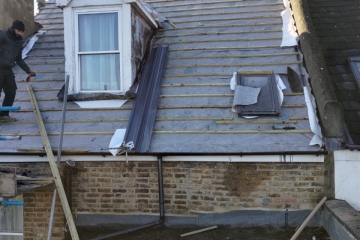 A roof in the process of being re-tiled in Croydon